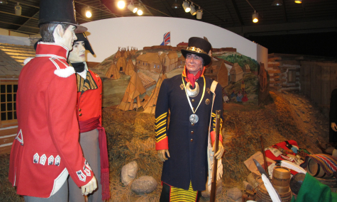man dressed in old fashioned military apparel in museum